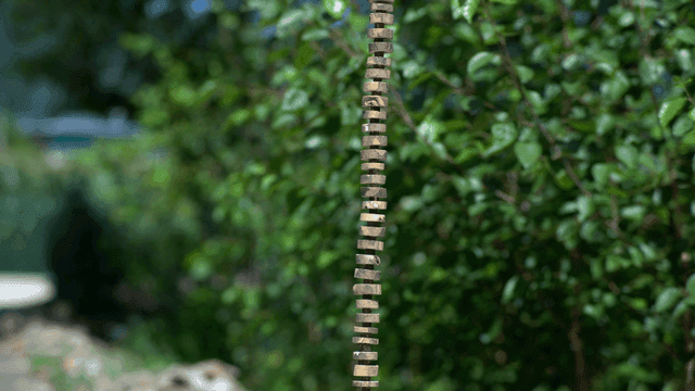 Stacked stones with a spiral top in a garden