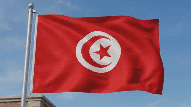 Red flag of Republic of Tunisia with crescent moon and star