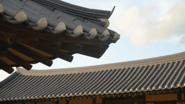 Traditional Korean roof against the sky