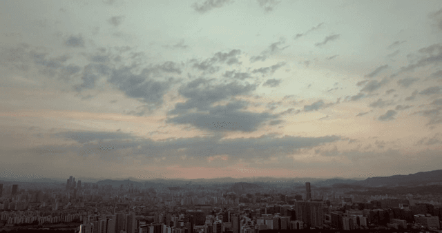 City skyline at dusk with colorful sky