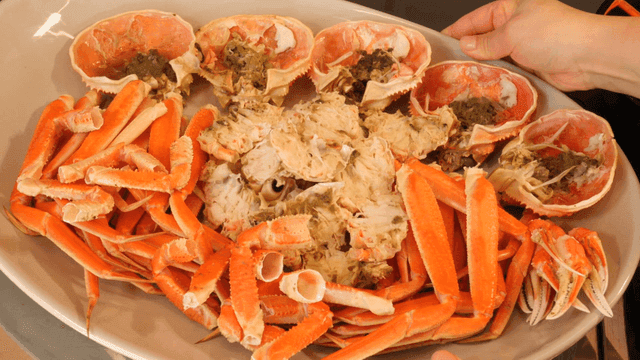 Plate with Fresh Steamed Crab Legs and Shells
