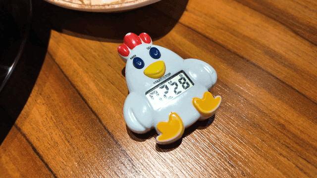 Chicken-shaped timer on table
