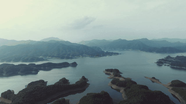 Tranquil lake surrounded by mountains