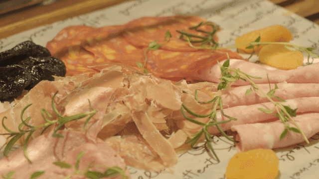 Platter with various hams and fruits