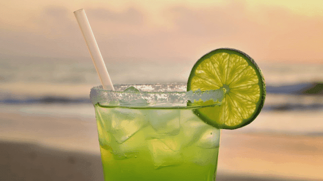 Refreshing lime cocktail by beach