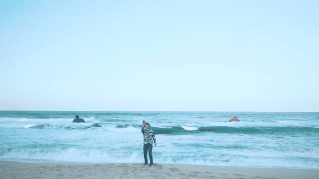 Man video calling from the sea