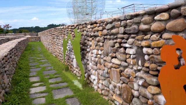 Stone Wall and Art Sculptures in a Park
