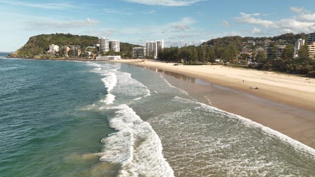 Serene Coastal Landscape with Waves and Beach