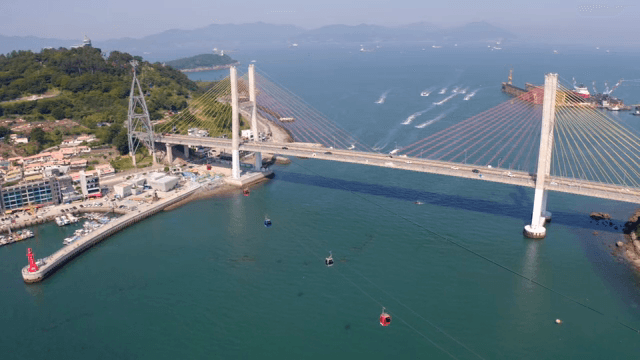 Sea with cable car and bridge