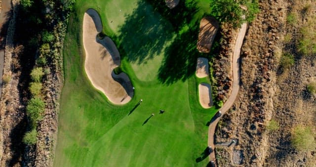 Aerial View of Golfers on a Green Course