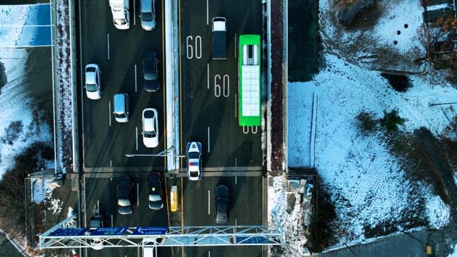 Overhead View of Traffic on Snowy Urban Roads