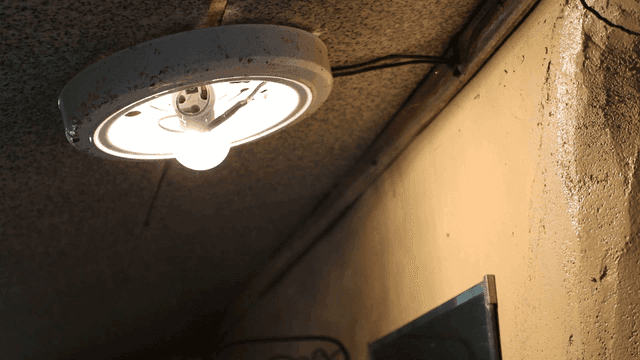 Old ceiling light in a dimly lit room