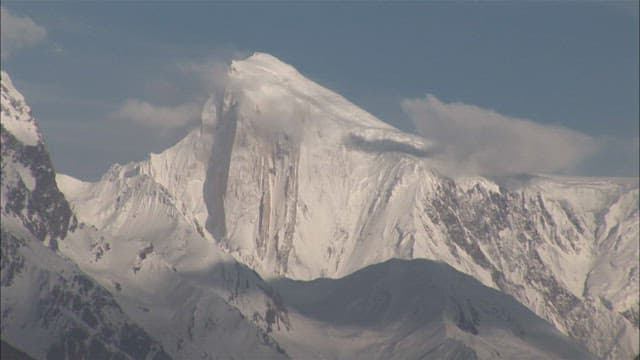 Majestic snow-covered Spantik Gold Peak seen in the distance