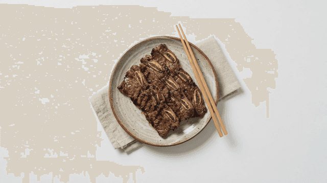 Grilled marinated ribs on plate