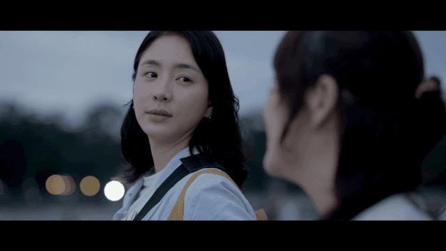 Two women looking at each other outdoors