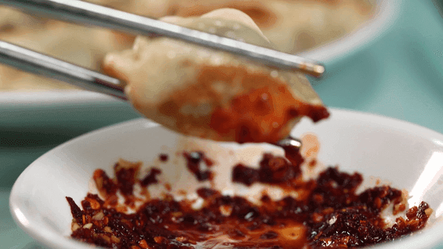 Dumpling dipped in spicy sauce