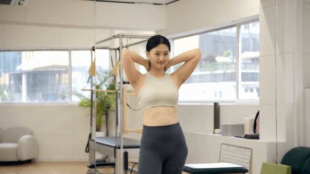Woman stretching in a fitness studio