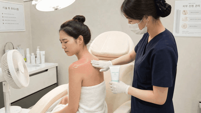 Women receiving treatment for sunburned skin