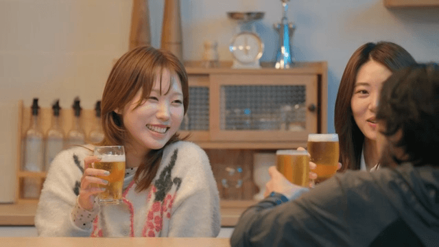 Friends toasting while enjoying beer together