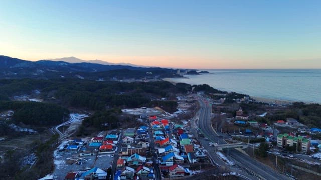 Coastal town with mountains and sea