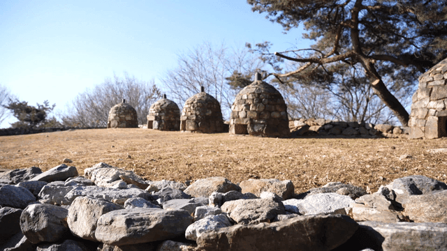 Traditional stone beacon tower in park