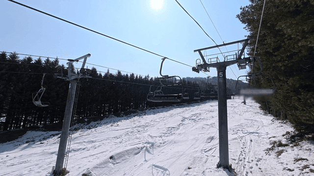 Ski lift over a snowy mountain slope