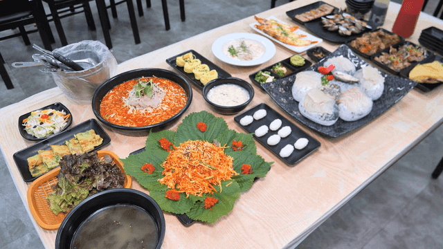 Various sashimi dishes on table