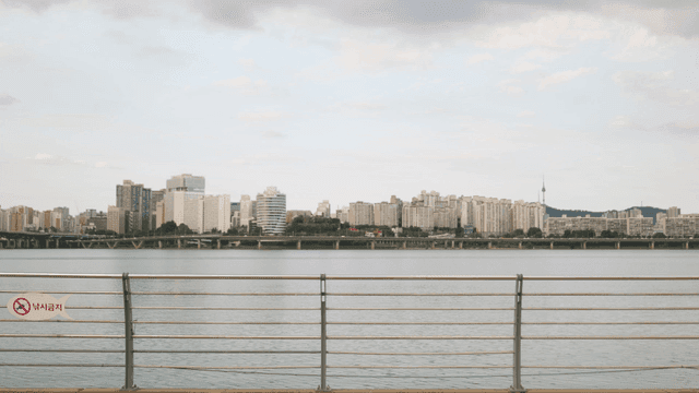 City skyline across a calm river