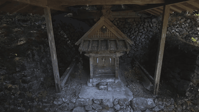 Small wooden shrine in forest