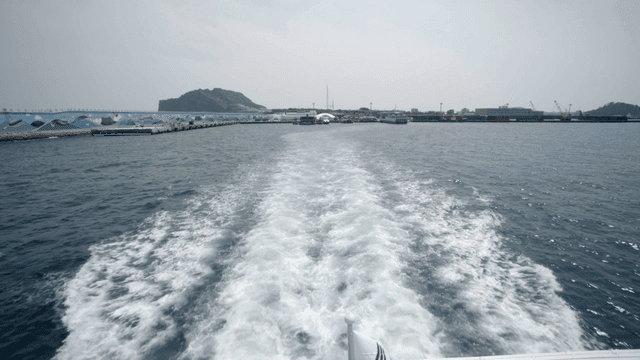 Boat leaving the harbor with waves