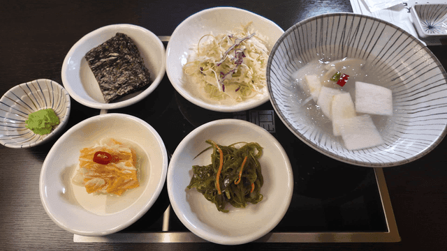 Table laden with various Korean side dishes