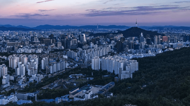 Sprawling cityscape with distant mountains