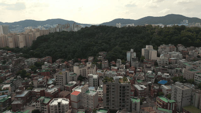 Cityscape with surrounding mountains