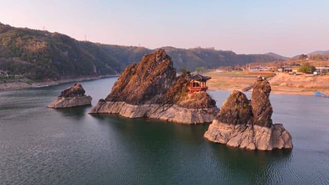 Traditional pavilion on rocky islets