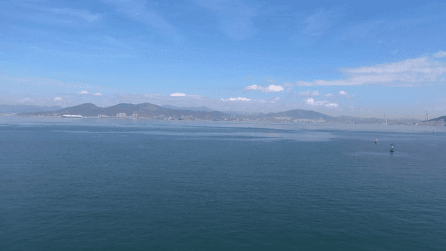 Vast sea with mountains visible in distance