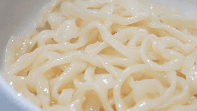 Bowl containing freshly boiled kalguksu noodles