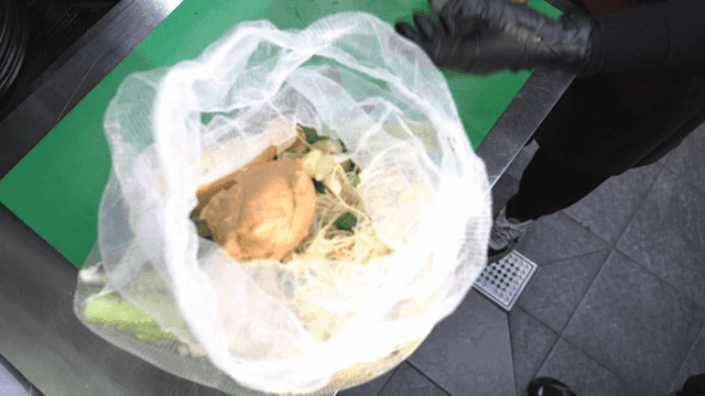 Ingredients in a mesh bag on a kitchen counter