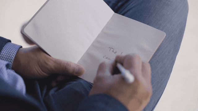 Person who writes English in notebook