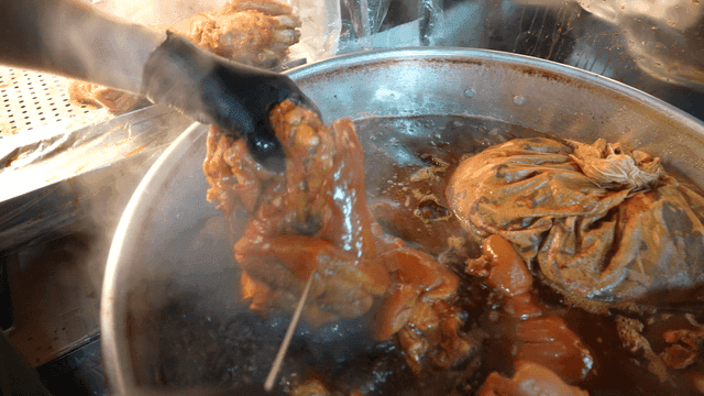 Pig's trotters being boiled in large pot