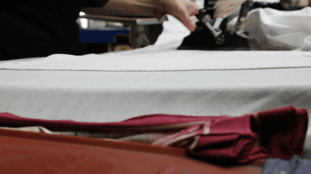 Ironing clothes on a table indoors