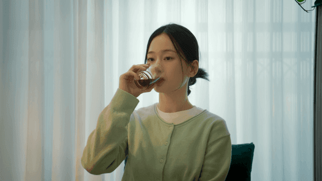 Woman drinking coffee at home