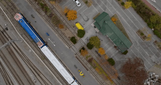 Aerial view of a train station with tracks