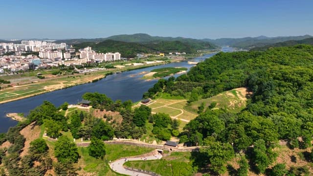 River flowing through a city and forest