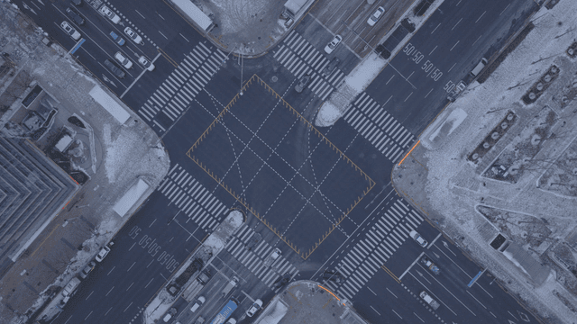 Aerial view of a snowy city intersection