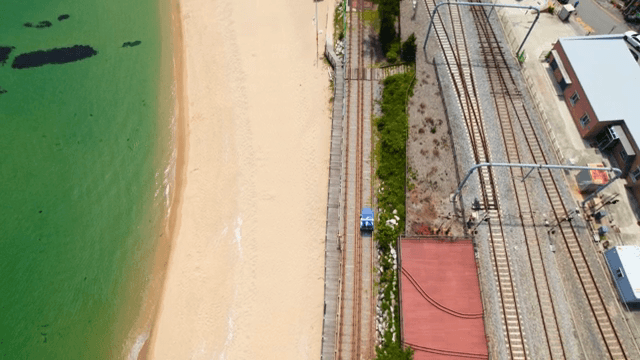 Scenic beach with adjacent railway