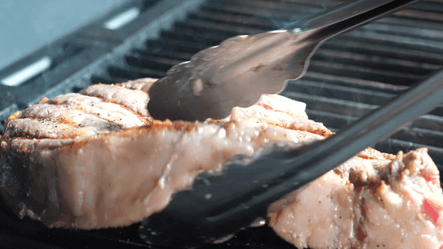 Tomahawk steak grilled on barbecue