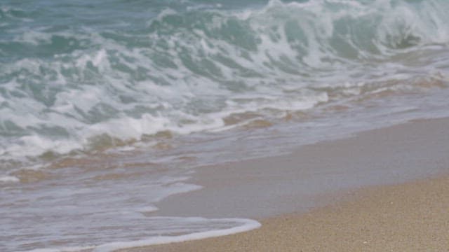 Gentle waves caressing a sandy beach