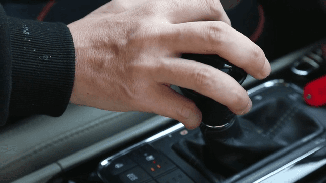 Hand on a car gear shift