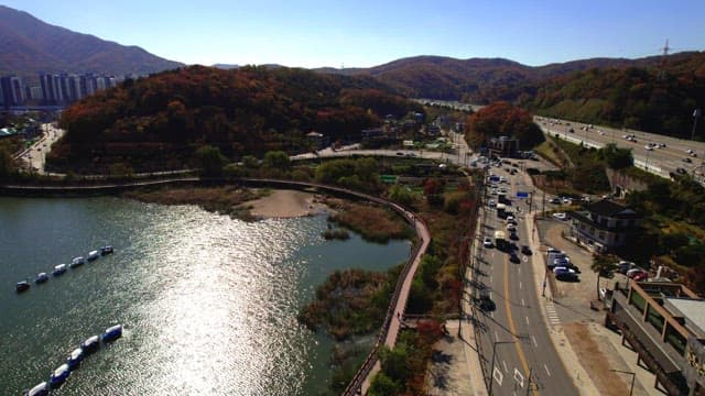 Scenic lakeside of Baegunhosu Lake road surrounded by mountains