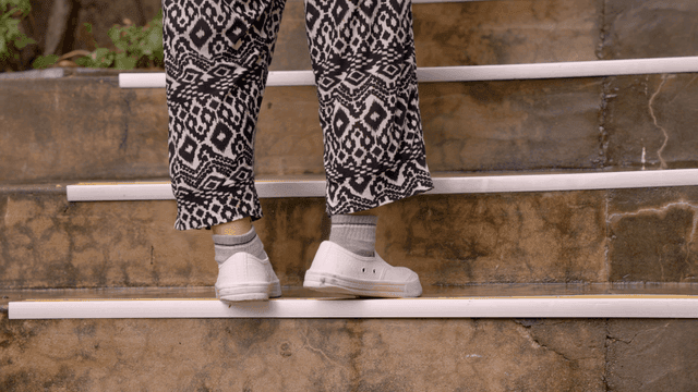 Person walking up outdoor stairs